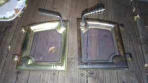 Before and after comparison of fireplace doors, showing professional cleaning by Chimney Karma in Fort Collins, CO.