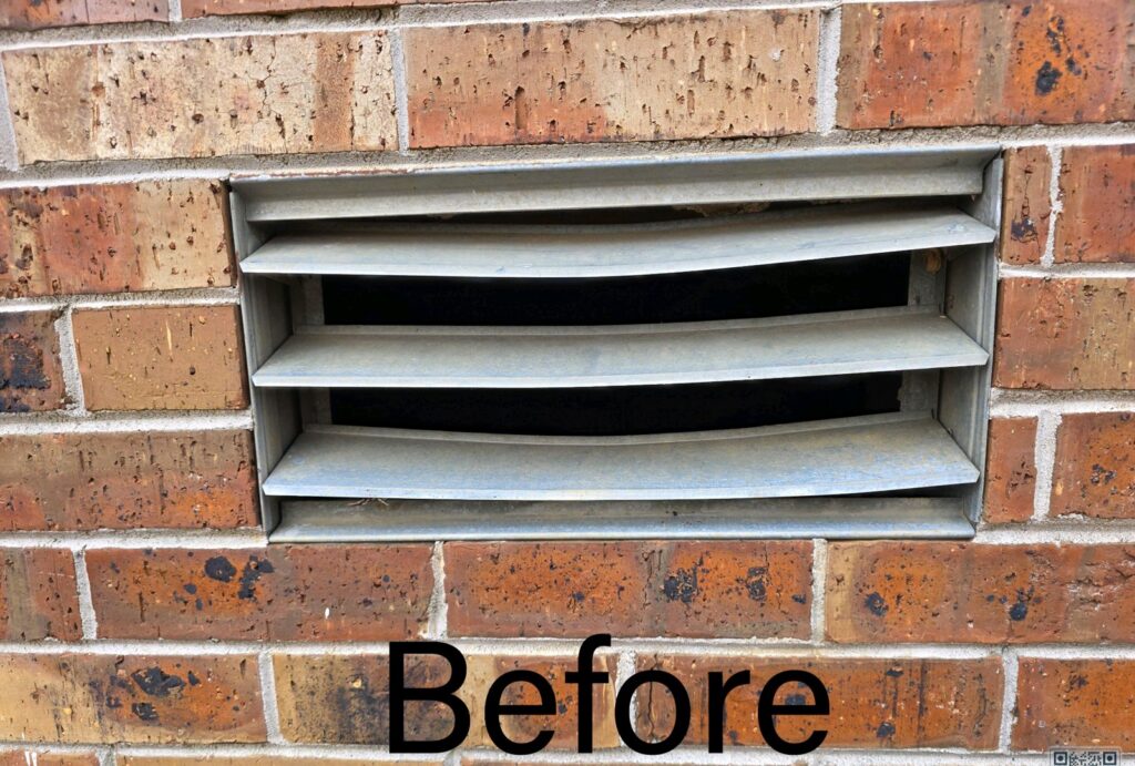 Before photo of an old vent on a brick wall, showing a potential entry point for pests for Hub City Pest Control in Jackson, TN
