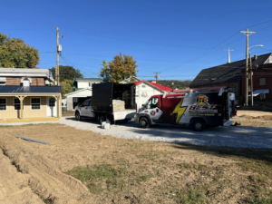Best Electric van parked at a new shed installation site in Charleston, WV, ready for electrical work.