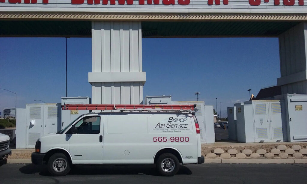 A Bishop Air Service van parked at a commercial HVAC installation or service site in Henderson, NV.
