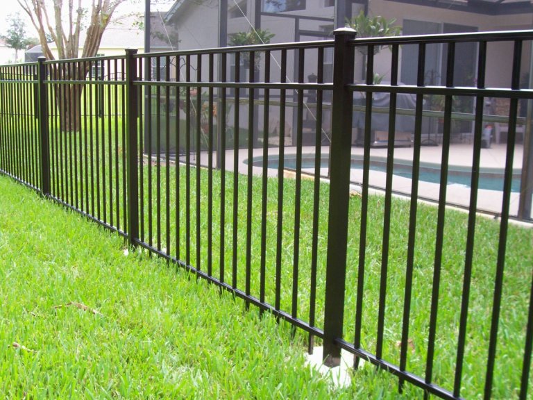 A black aluminum fence installed around a swimming pool area by Big Jerry's Fencing of Boise ID in Holly Springs, NC.
