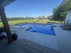 A black aluminum fence installed around a swimming pool by Fantastic Fences in Chattanooga, TN