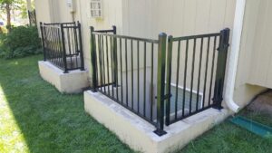 A black aluminum fence installed around a residential property by Royal Fence & Design LLC in Olathe, KS.