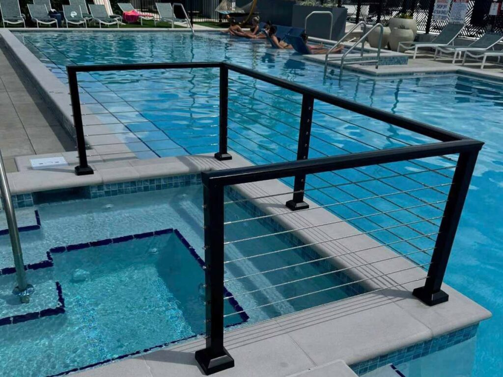 A black cable railing installed as a pool enclosure by Golden Eagle Fencing in Tampa, FL