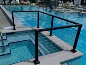 A black cable railing installed as a pool enclosure by Golden Eagle Fencing in Tampa, FL