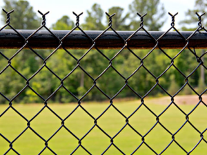 A close-up view of a black chain-link fence installed by Sacramento Fence Store in Sacramento, CA.