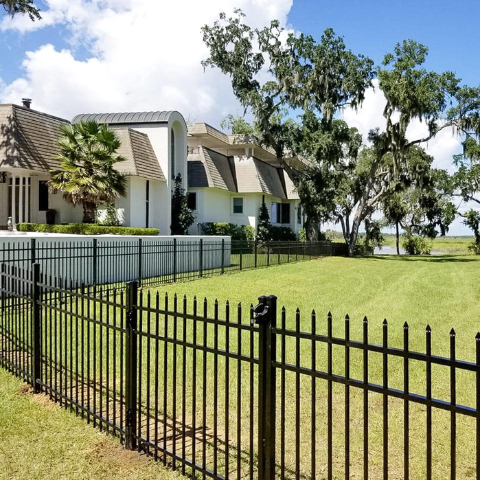 An elegant black metal fence installed around a large property by All In One Fence in Whitehouse Station, NJ.