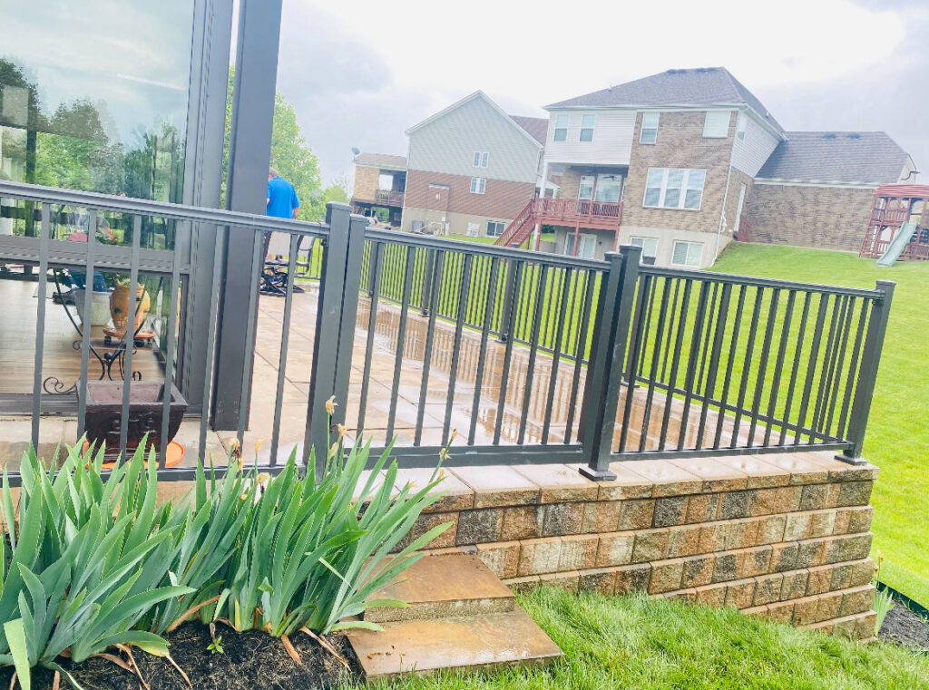 Black metal railing installed on a patio or deck by Superior Fence & Rail of Northern Kentucky in Florence, KY.