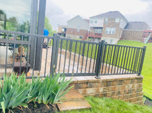 Black metal railing installed on a patio or deck by Superior Fence & Rail of Northern Kentucky in Florence, KY.