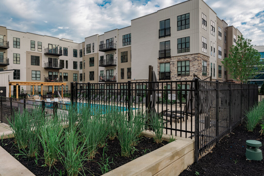 A black metal fence enclosing a swimming pool area at an apartment complex by Integrous in Gap, PA