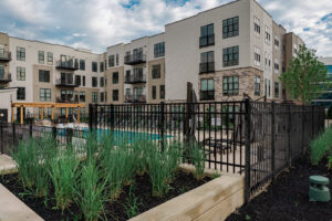A black metal fence enclosing a swimming pool area at an apartment complex by Integrous in Gap, PA