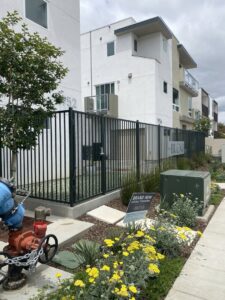 A black metal security fence installed around a new building by All Around Fence Page in Imperial Beach, CA.