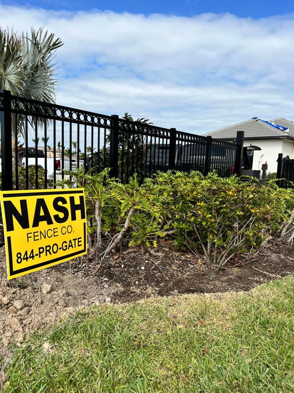 A newly installed black ornamental fence in a residential area by Nash Fence & Supplies Inc. in Lake Charles, LA.