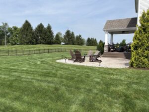 A black ornamental fence installed along a residential property line by Sharper Image Fence in Fort Wayne, IN.