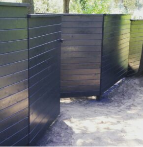 A black ornamental iron fence bordering a baseball field, installed by The Fence Company in Fresno, CA.