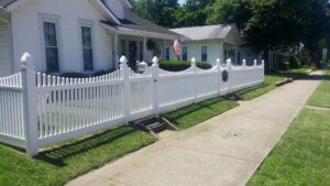 A black ornamental iron fence and an automatic sliding gate installed at a commercial property by Best Fence & Gate LLC in Louisville, KY.