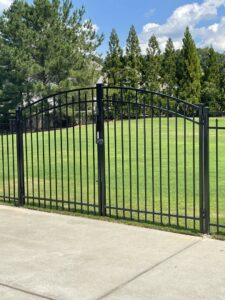 A black ornamental metal gate with an arched top installed by Georgia Select Fence in Senoia, GA.