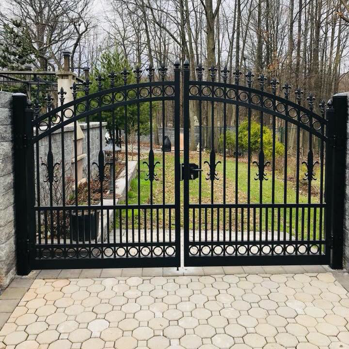 A black ornamental metal double gate installed by Elite Ornamental Fence LLC in Paterson, NJ.