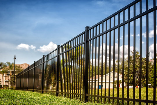 A black ornamental metal fence installed in a residential area by KY Fencing Unlimited in Louisville, KY.
