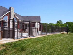 A black ornamental fence installed around a swimming pool for safety by Raatz Fence Company in Louisville, KY.