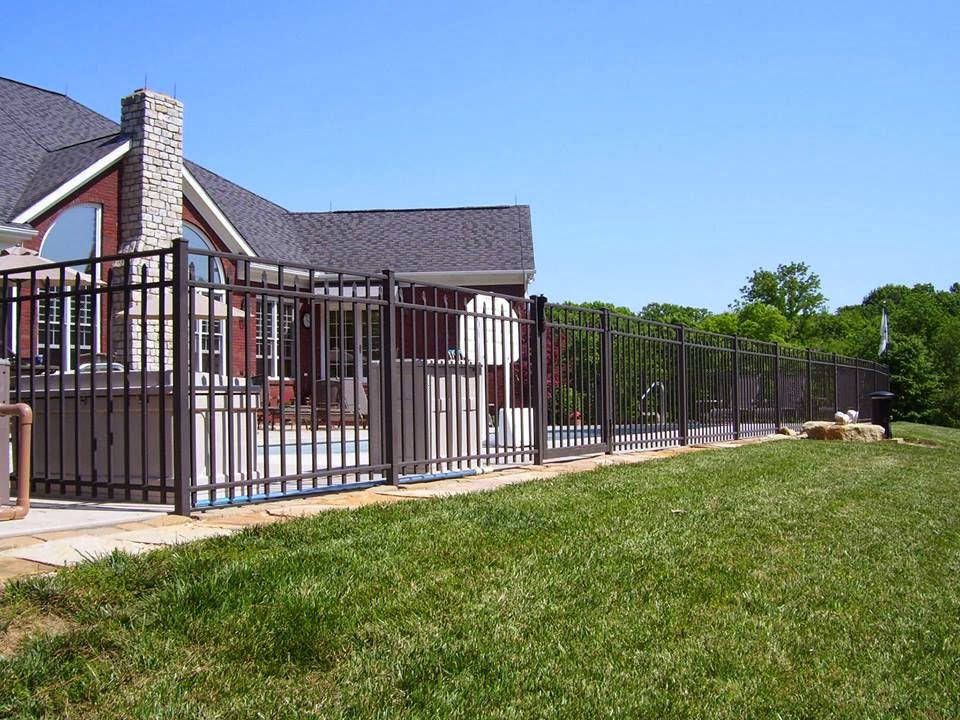 A black ornamental fence installed around a swimming pool for safety by Raatz Fence Company in Louisville, KY.