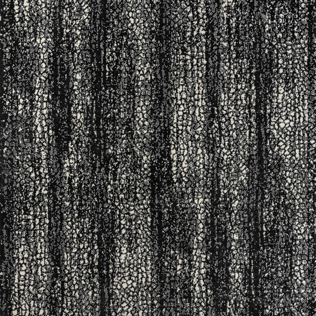 A close-up of a black and white patterned carpet, available at Artifacts Fine Rugs and Flooring in South Salt Lake, UT.