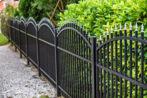 An elegant black wrought iron fence with decorative spikes installed by Delmarva Facility Maintenance Services in Selbyville, DE.