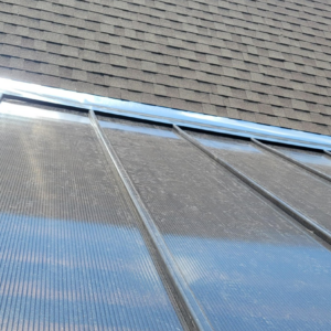 A newly installed black wrought iron fence running along a property line by Ft Worth Fence And Patio in Fort Worth, TX.