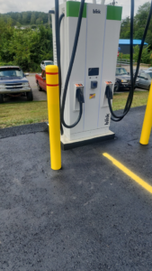 A Blink EV charging station with protective yellow bollards installed by Pittsburgh Electric & Maintenance in Pittsburgh, PA