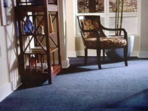 A room featuring a vibrant blue carpet installed by Floor Designs Unlimited, LLC in Pittsburgh, PA