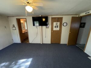 A newly installed blue carpet in a living room by Carpet Mart of Idaho Falls in Idaho Falls, ID.