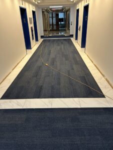 Blue carpet tile hallway installation in a commercial building by Branch Floor Covering in Cranston, RI