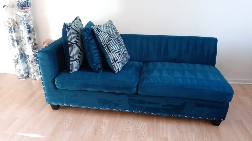 A blue upholstered sofa displaying fresh cleaning lines after professional service by Steam Choice Carpet Care Inc in Chicago, IL.