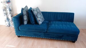 A blue upholstered sofa displaying fresh cleaning lines after professional service by Steam Choice Carpet Care Inc in Chicago, IL.