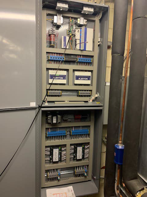 An open building management system (BMS) control panel with Alerton controllers by Allstate Heating & Cooling in Lexington, KY.