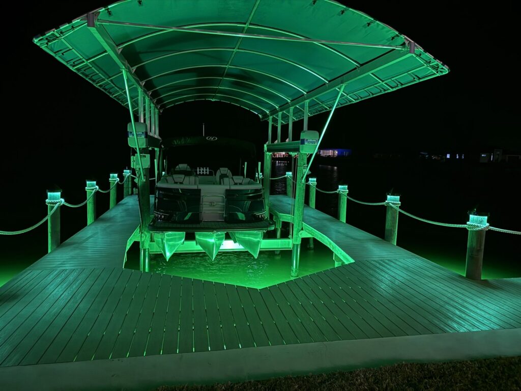 Boat lift and dock lighting installation with green underwater lights by Ryno Electric in Cape Coral, FL