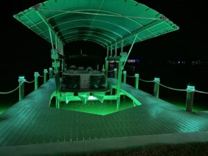 Boat lift and dock lighting installation with green underwater lights by Ryno Electric in Cape Coral, FL