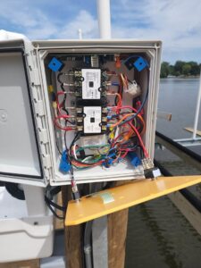 Detailed view of the intricate wiring inside a boat lift electrical control box by Apparent Electric LLC in Oshkosh, WI.