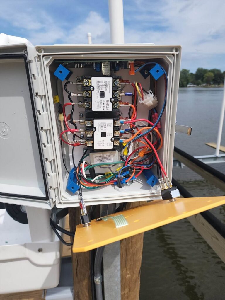 Detailed view of the intricate wiring inside a boat lift electrical control box by Apparent Electric LLC in Oshkosh, WI.
