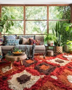 A bohemian-style sunroom featuring a large, textured, multi-colored area rug from Odino Designs, llc in Portland, OR.