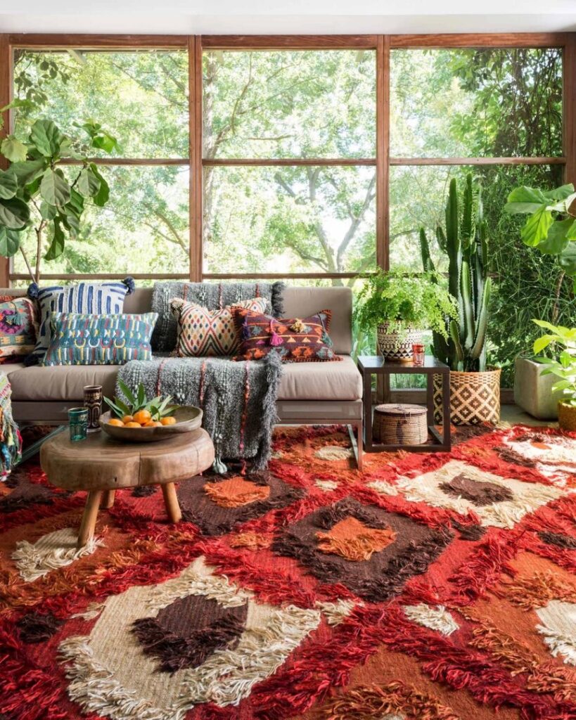 A bohemian-style sunroom featuring a large, textured, multi-colored area rug from Odino Designs, llc in Portland, OR.