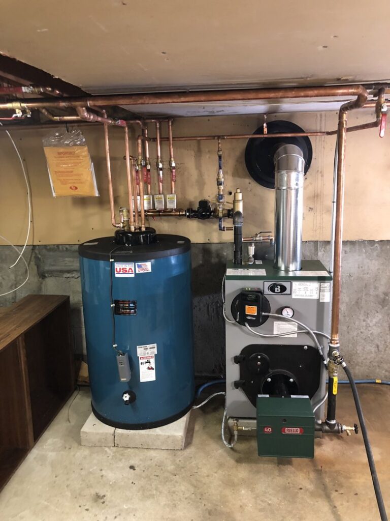 A boiler and blue water heater installation with copper piping by JLP Heating & Cooling in Norwalk, CT