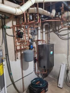 A complex boiler and hydronic piping system installation by Tom's Heating Service in Waukesha, WI.