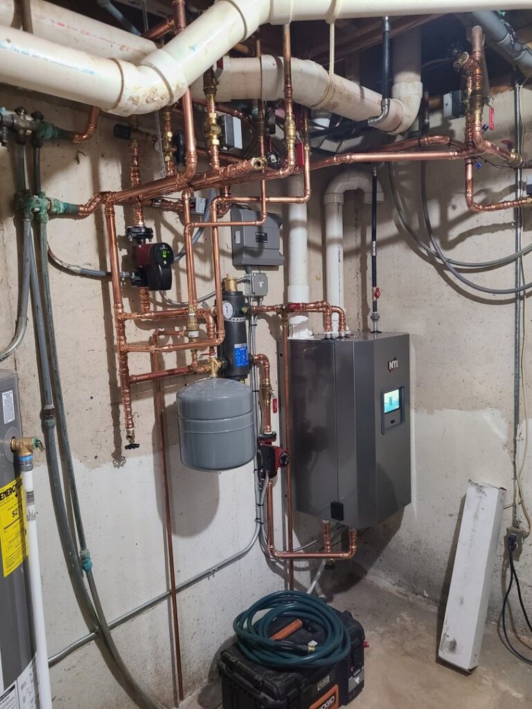 A complex boiler and hydronic piping system installation by Tom's Heating Service in Waukesha, WI.