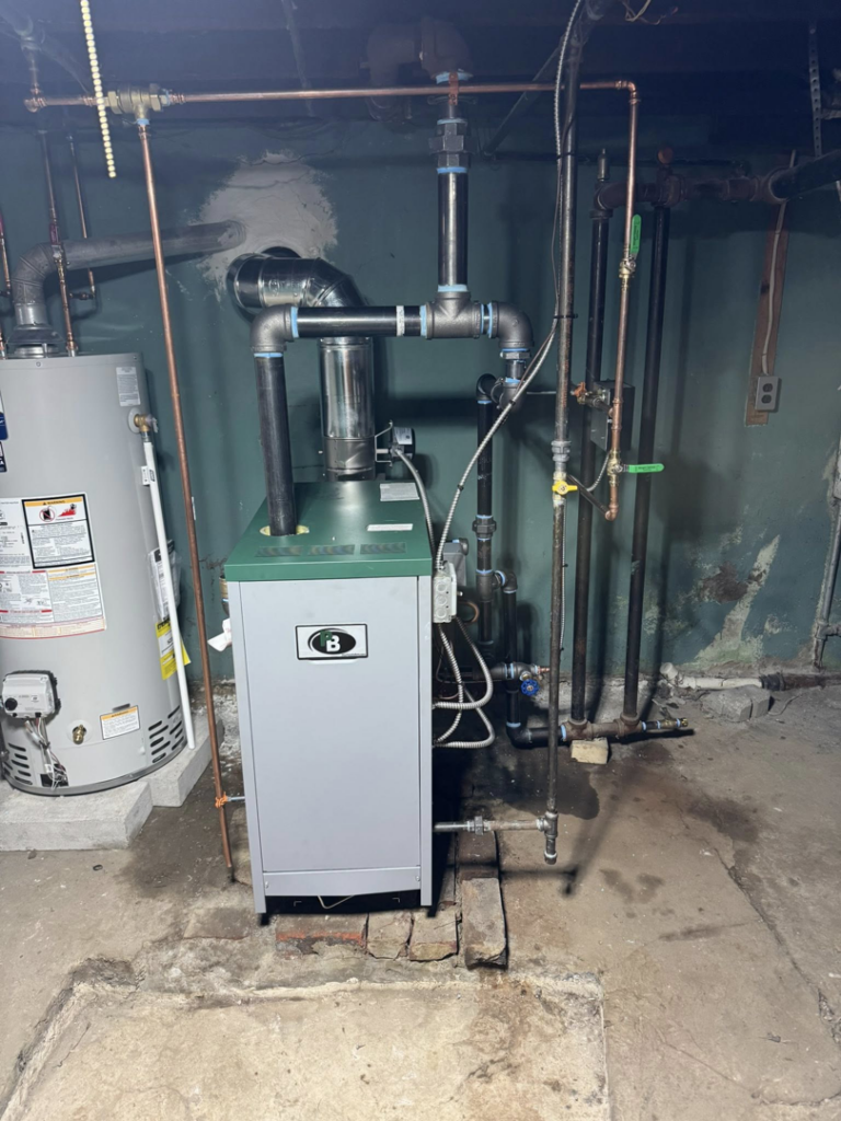 A boiler and traditional water heater installation by C&A HVAC LLC in Springfield, PA.