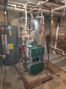 A new boiler and water heater installation with copper piping by HVAC Royal Service Inc in Chicago, IL.