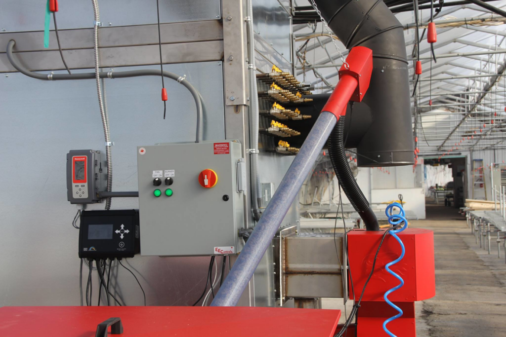 A close-up of a boiler control panel and associated piping system, showing the intricate work of Kedel Boilers in Portland, ME.