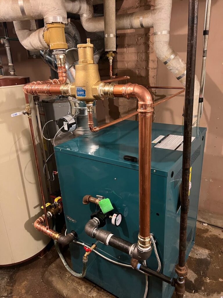 A newly installed boiler or furnace with copper piping by Done Right Air in West Allis, WI