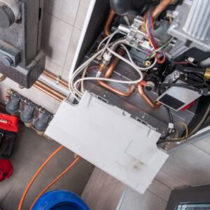 Internal components of a boiler or furnace being serviced by All The Way Heating & Cooling in Middleburgh, NY