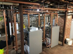 A complex boiler and furnace system with new copper piping installed by Advanced Comfort LLC in Concord, NH.